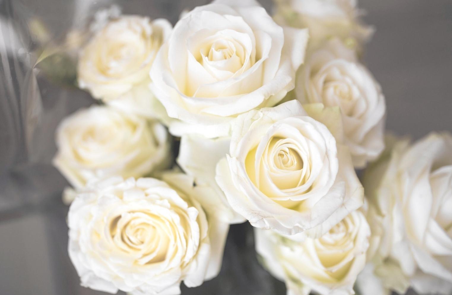 Fresh flower arrangements being carefully prepared in our workshop